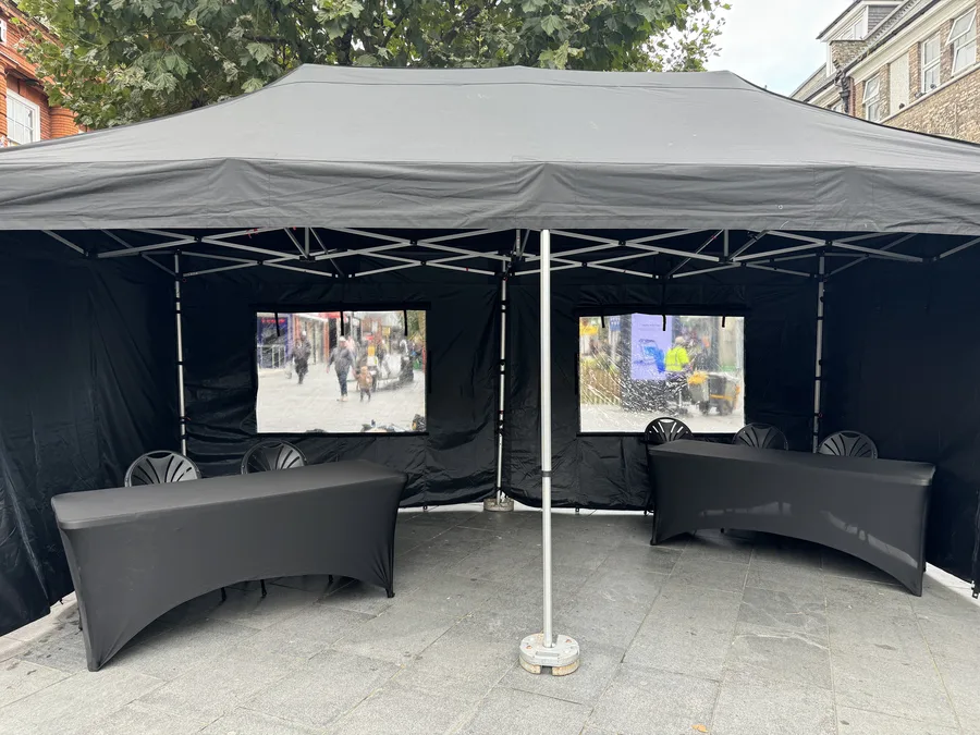 3x6m Rhino gazebo dressed with tables and screens